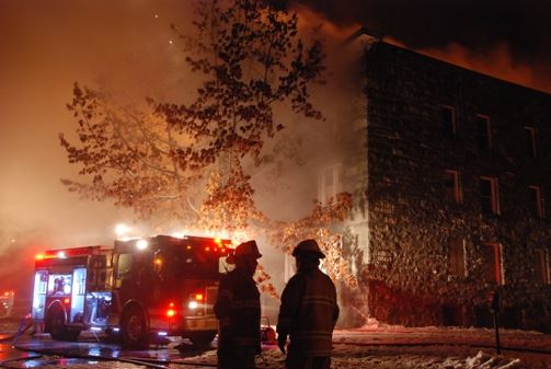 Smoking coming from a building with the fire department outside